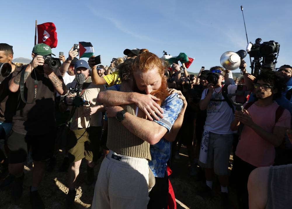 Britain's Russ Cook reacts after becoming the first person to run the entire length of Africa. REUTERS