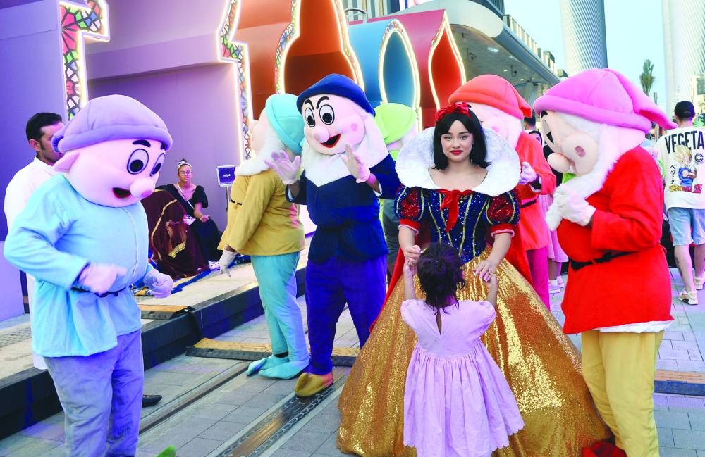 Performers dressed as 'Snow White and the Seven Dwarfs' entertain children at Lusail Boulevard Friday, as part of the Eid al-Fitr celebrations. PICTURE: Shaji Kayamkulam