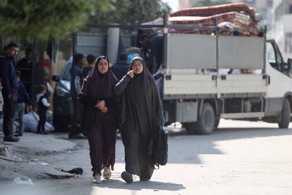 Palestinians prepare their belongings as they evacuate homes in the Nuseirat refugee camp in central Gaza, on Friday. AFP