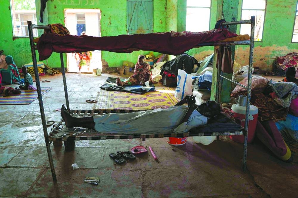 
File photo shows internally displaced Sudanese reside in the Hasahisa secondary school, transformed to house people fleeing violence in the war-torn country. 