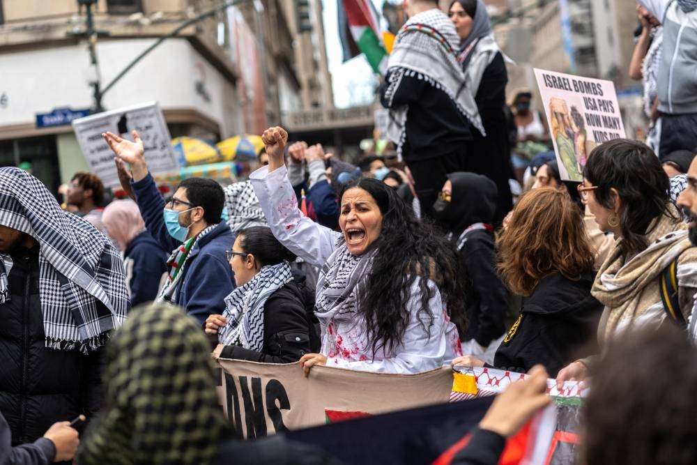 Demonstrators attend a protest demanding a ceasefire and the end of Israeli attacks on Gaza in New York City, US. REUTERS