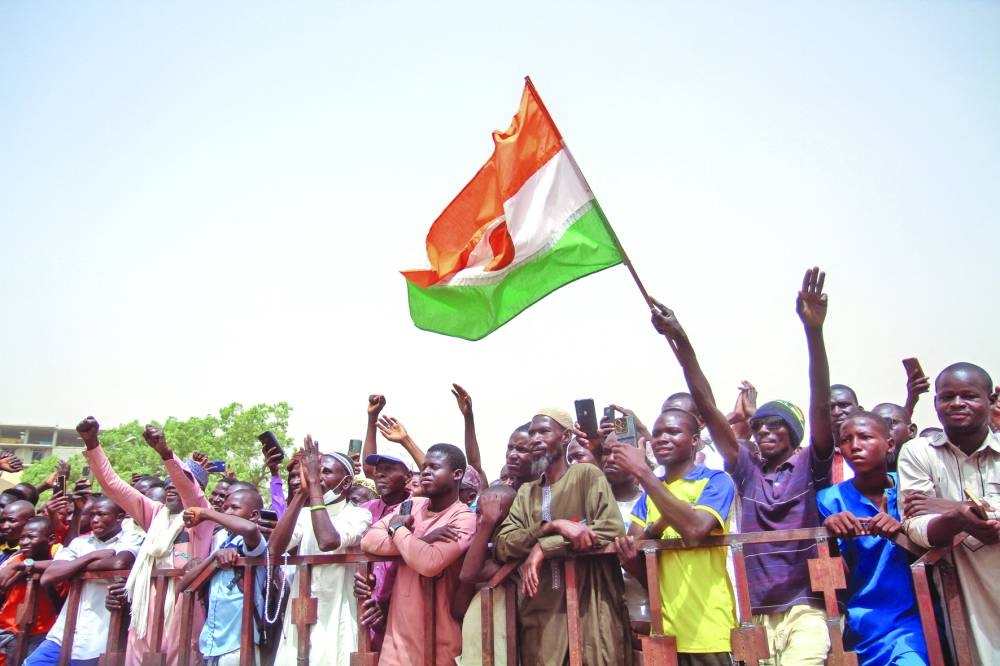 Nigeriens gather in a street to protest against the US military presence, in Niamey, Niger, yesterday.
