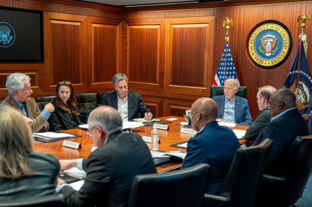 US President Joe Biden meets with members of his national security team as seen in this White House handout image taken in the Situation Room at the White House, in Washington, US, on Saturday. The White House/Handout via REUTERS