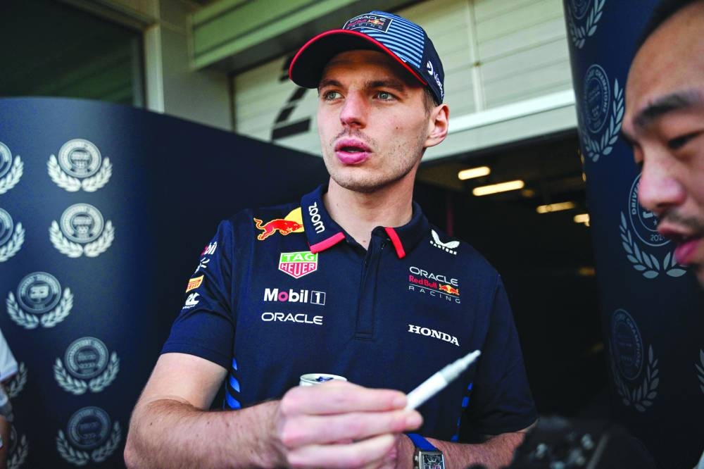 Red Bull Racing's Dutch driver Max Verstappen signs an autograph at the Shanghai International circuit ahead of the Formula One Chinese Grand Prix in Shanghai on Thursday. (AFP)