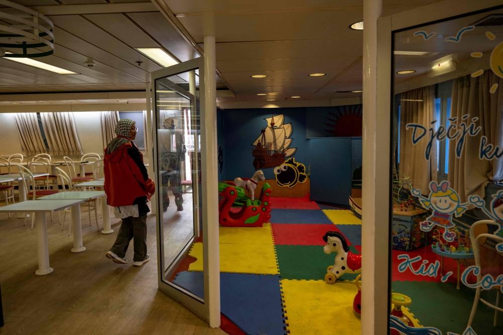 Activist and journalists tour on board the Akdeniz RoRo ship before its departure from the Tuzla seaport near Istanbul on Friday. AFP