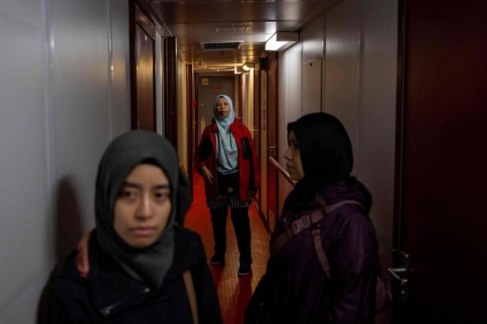 Activist and journalists tour on board the Akdeniz RoRo ship before its departure from the Tuzla seaport near Istanbul on Friday. AFP
