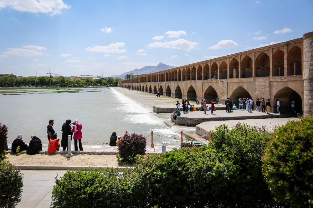 People visit the Si-o-Se Pol Bridge in Iran's central city of Isfahan on Friday. AFP