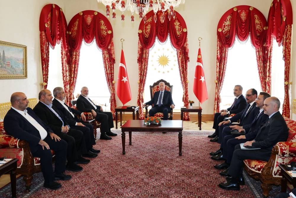 Turkey's President Tayyip Erdogan meets with Ismail Haniyeh, leader of Hamas, in Istanbul, Turkey, on Saturday. Murat Cetinmuhurdar/Turkish Presidential Press Office/Handout via REUTERS
