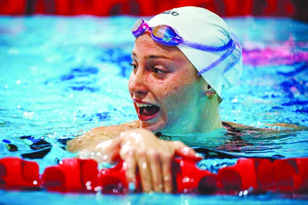 Mollie O’Callaghan reacts after competing in the women’s 100m backstroke event during the Australian Open Swimming Championships at the Gold Coast Aquatic Centre on Saturday. (AFP)