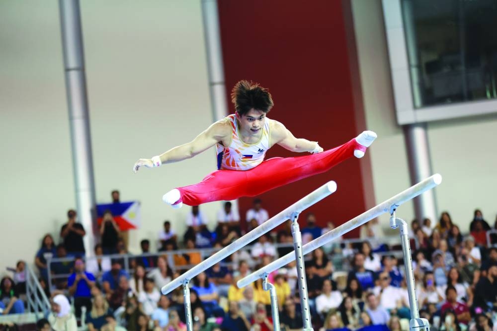Carlos Yulo of the Philippines performs on the parallel bars during the Artistic Gymnastics World Cup Doha at the Ladies Sports Hall on Saturday.