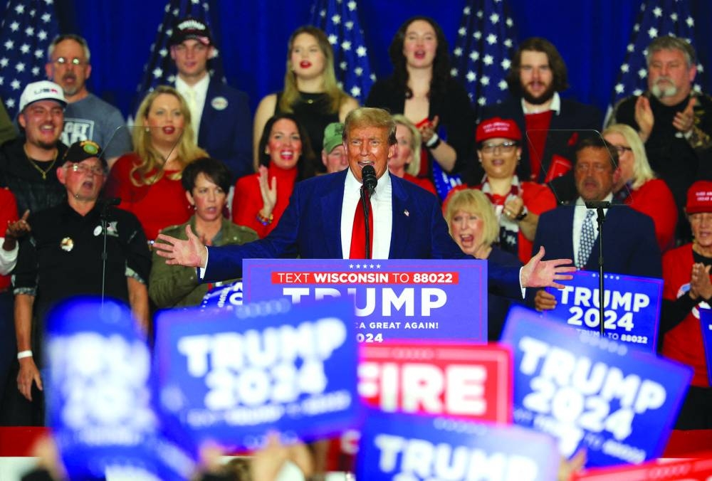 
Republican presidential candidate and former US President Donald Trump speaks during a campaign rally in Green Bay, Wisconsin. (Reuters) 