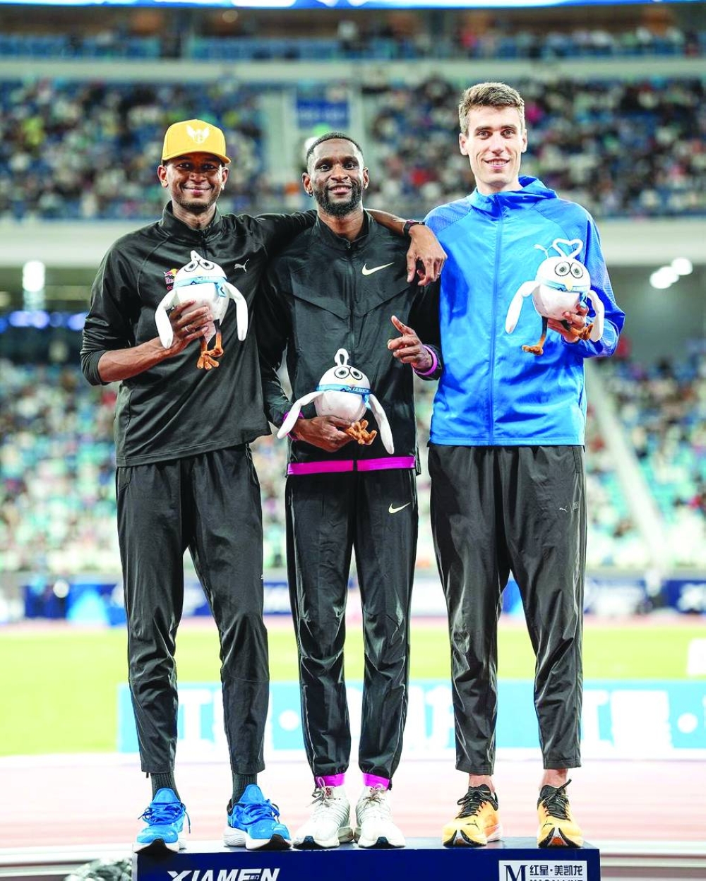 Shelby McEwen (centre) won the high jump event ahead of Mutaz Barshim and Hamish Kerr at the Xiamen Diamond League on Saturday.
