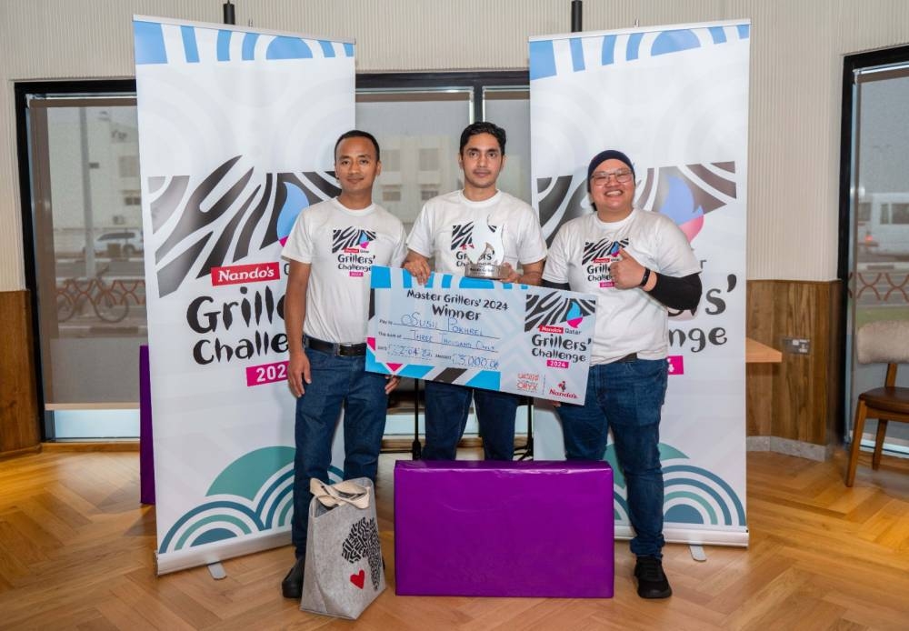 Nando’s Qatar 2024 Master Griller Winner Susil Pokhrel with 1st runner-up Bishnu Gurung and 2nd runner-up Jean Pararillaga.
