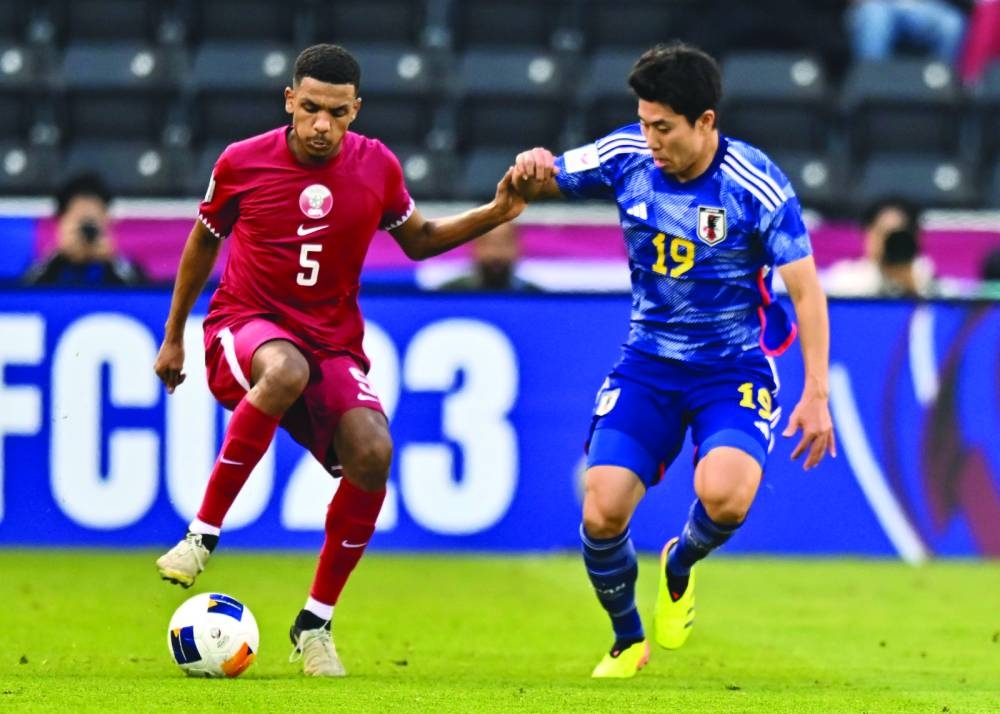 Japan’s Mao Hosoya (right) vying for the ball with Qatar’s Hashmi al-Hussain during their AFC U-23 Asian Cup Qatar 2024 quarter-final at Jassim Bin Hamad Stadium in Doha on Thursday. PICTURES: Noushad Thekkayil