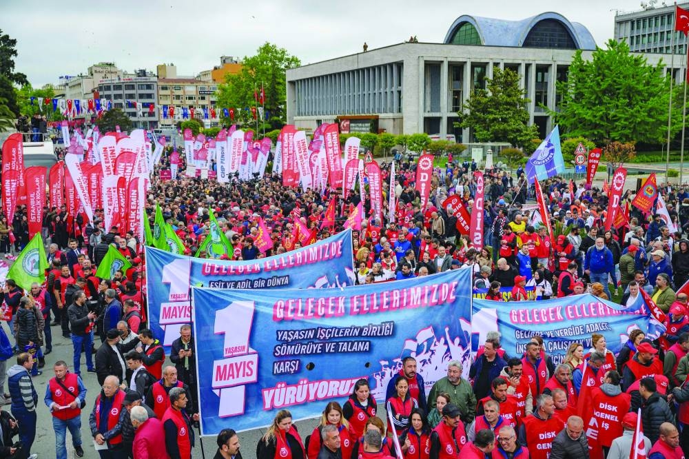 Union members march towards Taksim Square during a May Day (Labour Day) rally, marking International Workers' Day, in Istanbul, yesterday.