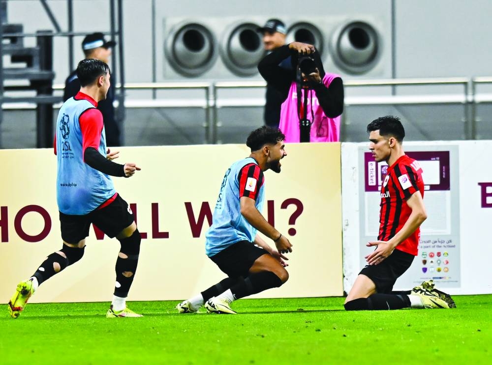 Al Rayyan’s Achraf Bencharki (right) celebrates with teammates after scoring against Al Gharafa at the Khalifa International Stadium. PICTURE: Noushad Thekkayil
