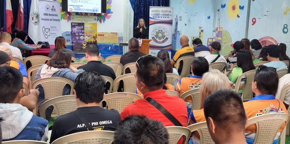 Cherry Cureg addresses the attendees of the World Day Safety and Health at Work 2024.