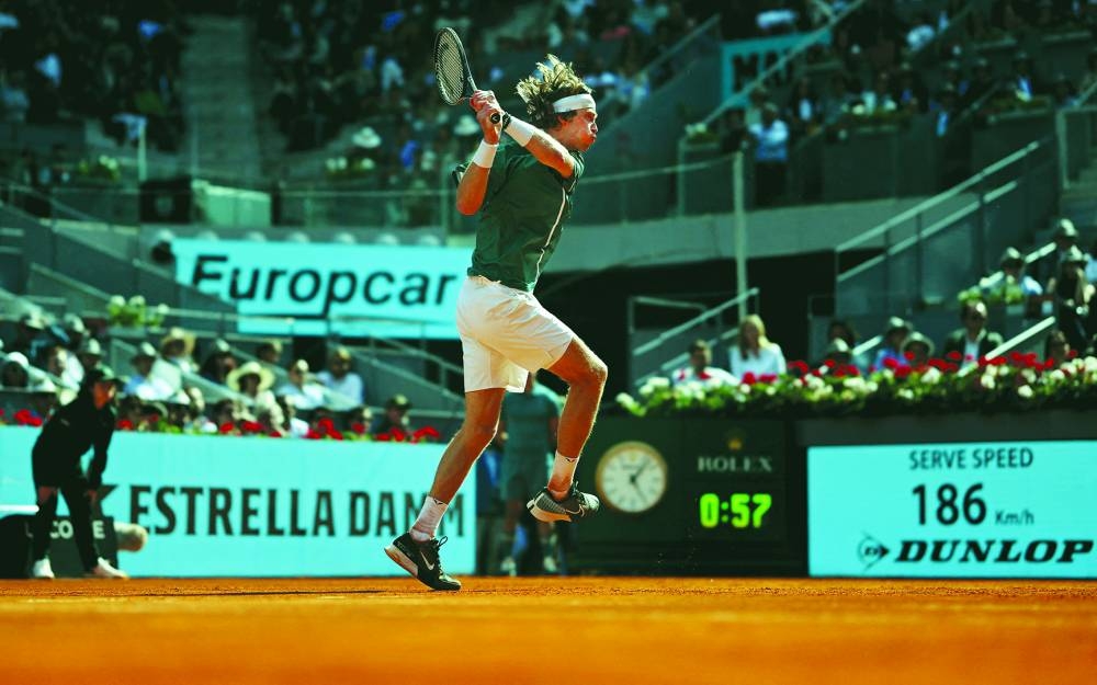 Russia’s Andrey Rublev plays a return against Taylor Fritz of the US during the Madrid Open semi-final on Friday. (AFP)