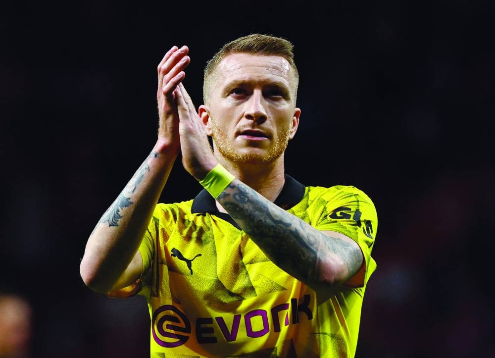 Borussia Dortmund's Marco Reus applauds fans after the match. (Reuters)