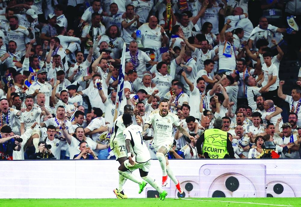 Real Madrid’s Joselu celebrates scoring their first goal with teammates in the Champions League second leg semi-final against Bayern Munich at Santiago Bernabeu in Madrid on Wednesday. (AFP)