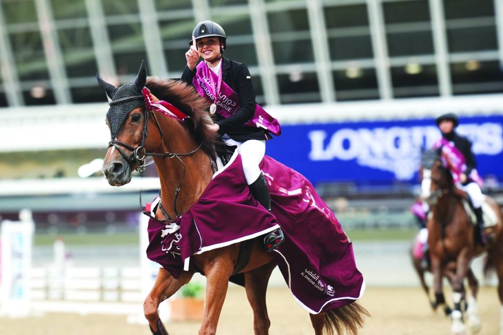 
Ghada Thani al-Sowaidi astride Sandro Girl celebrates after winning the Ladies’ class 90cm event at the Al Shaqab Showjumping League. 
