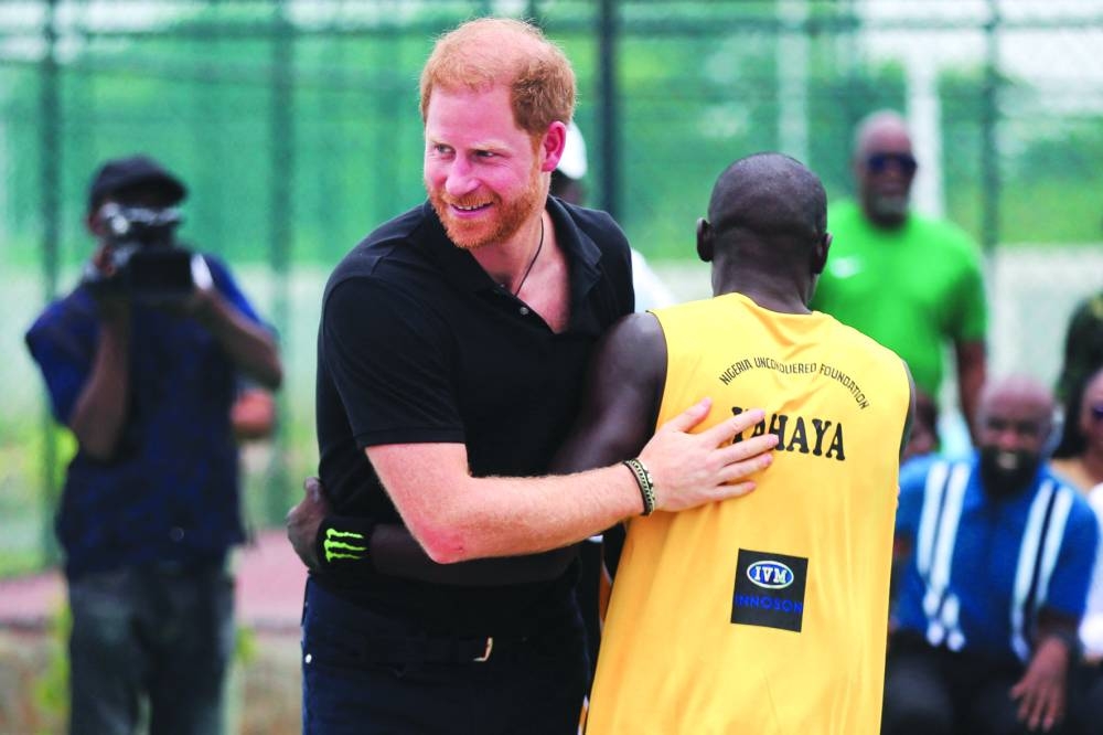
Harry and Meghan at a volleyball match with wounded army veterans at the Nigerian army officers’ mess in Abuja. 