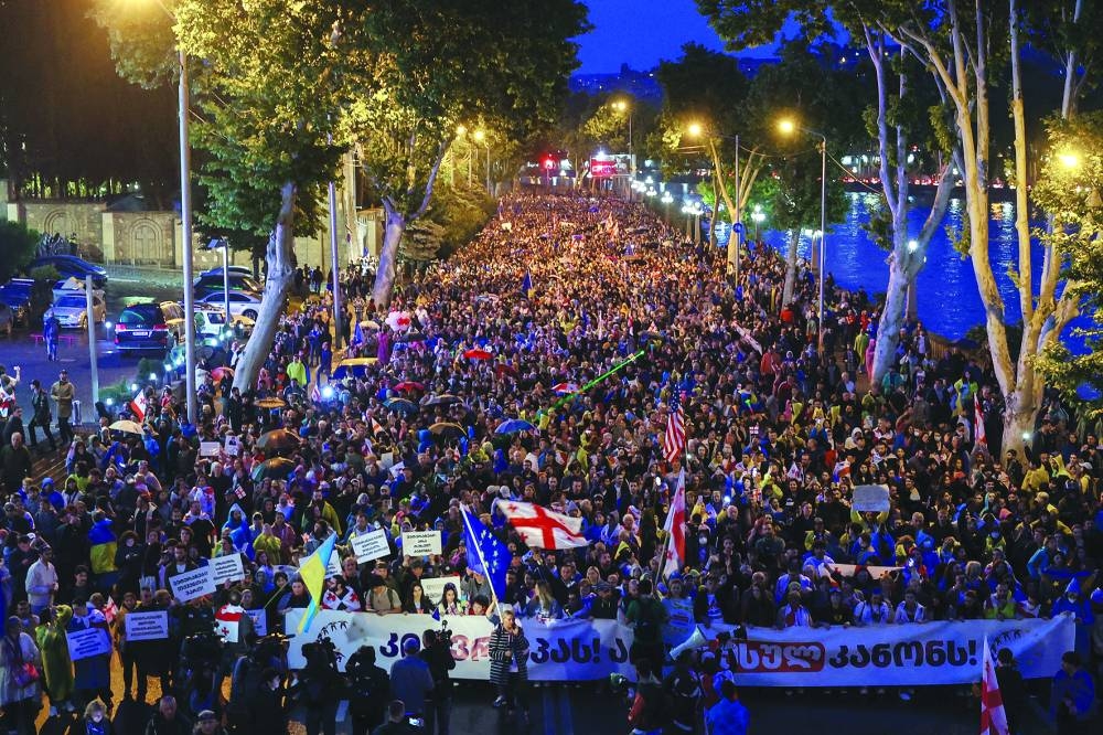 
Demonstrators hold a rally to protest a bill on ‘foreign agents’ in Tbilisi. 