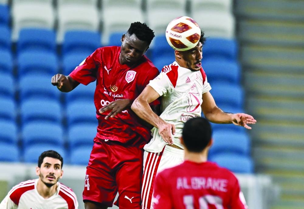
Al Duhail’s Michael Olunga (left) and Al Arabi’s Jassem Gaber go for a header during the Amir Cup semi-final at the Al Janoub Stadium. PICTURES: Noushad Thekkayil 