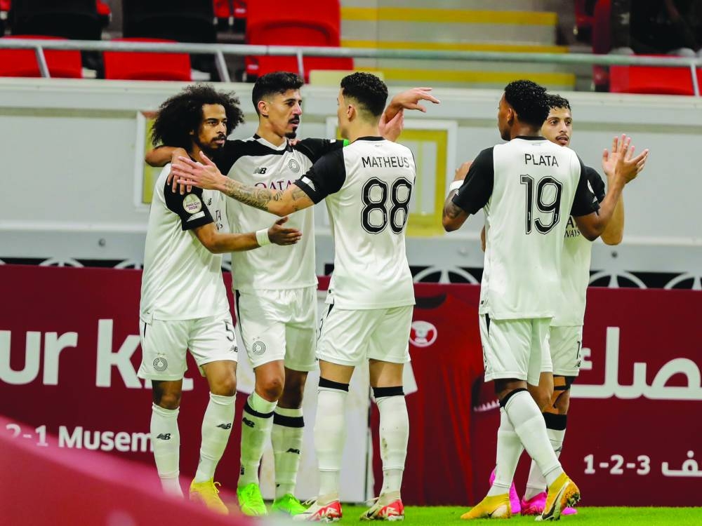 Al Sadd’s Baghdad Bounedjah (second left) celebrates after scoring against Al Wakrah at the Ahmed Bin Ali Stadium.