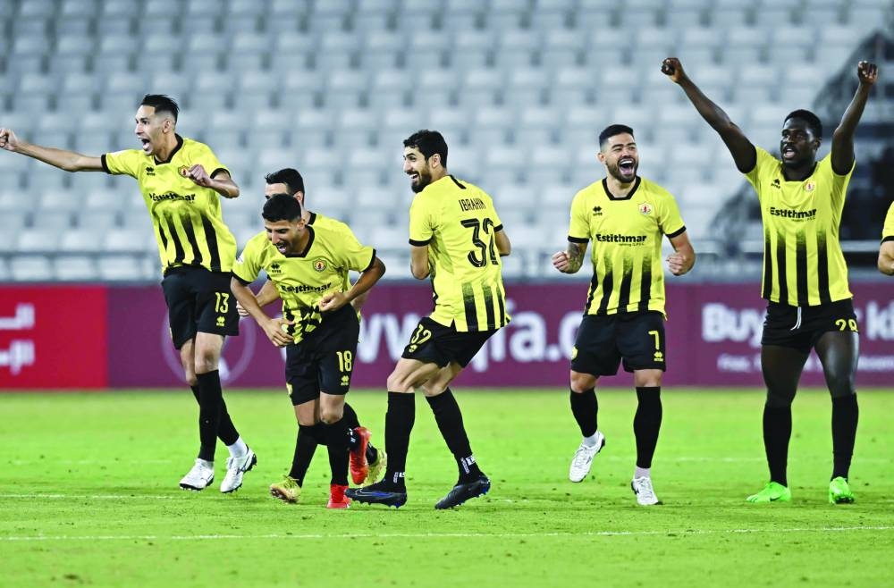 Qatar SC players celebrate after their penalty shootout win over Al Rayyan in the quarter-finals of the Amir Cup at the Jassim Bin Hamad Stadium on Tuesday. PICTURES: Noushad Thekkayil