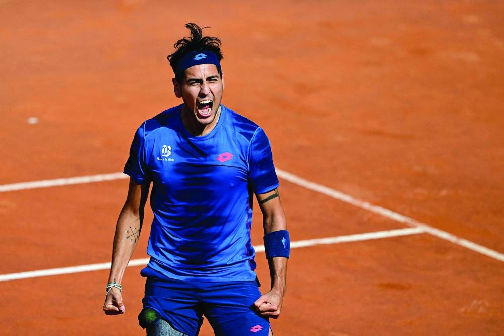 Chile’s Alejandro Tabilo celebrates after winning against China’s Zhang Zhizhen during the Rome Open match on Wednesday. (AFP)