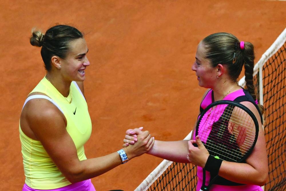 Belarus’ Aryna Sabalenka (left) shakes hands with Latvia’s Jelena Ostapenko after winning her match at the Rome Open on Wednesday. (AFP)