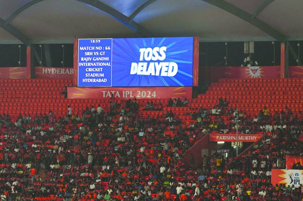 A big screen shows the toss being delayed due to rain before the start of the IPL match between Sunrisers Hyderabad and Gujarat Titans in Hyderabad on Thursday. (AFP)