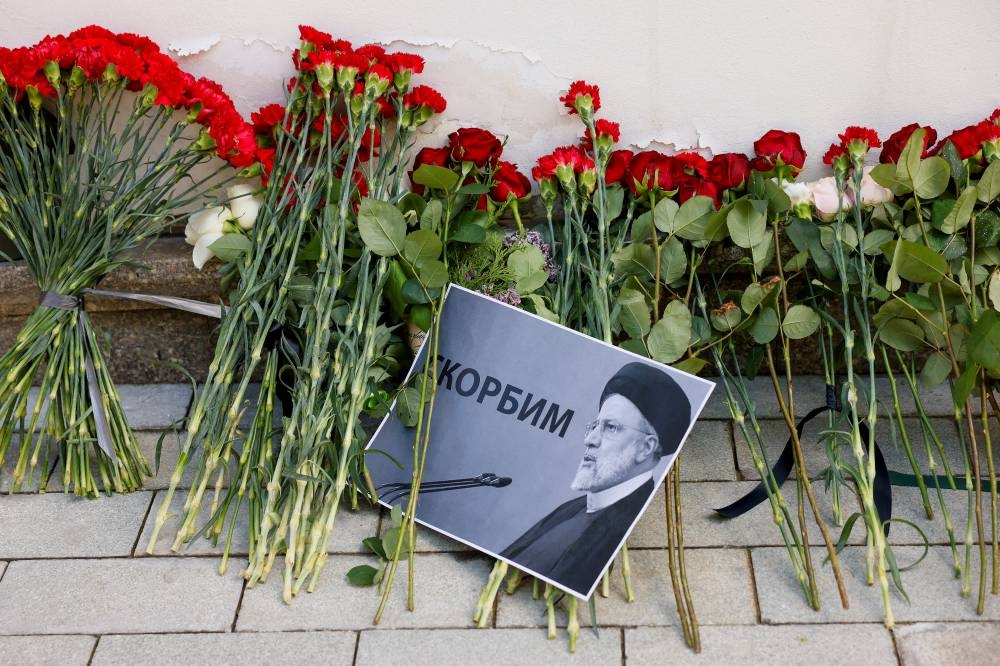 A view shows flowers outside the Iranian embassy placed to pay tribute to Iran's President Ebrahim Raisi, Foreign Minister Hossein Amirabdollahian and other victims of a recent helicopter crash in mountainous terrain near Iran's border with Azerbaijan, in Moscow, Russia. REUTERS