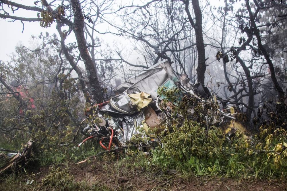 A view of the wreckage of Iranian president Ebrahim Raisi's helicopter at the crash site on a mountain in Varzaghan area, northwestern Iran. Stringer/WANA via REUTERS