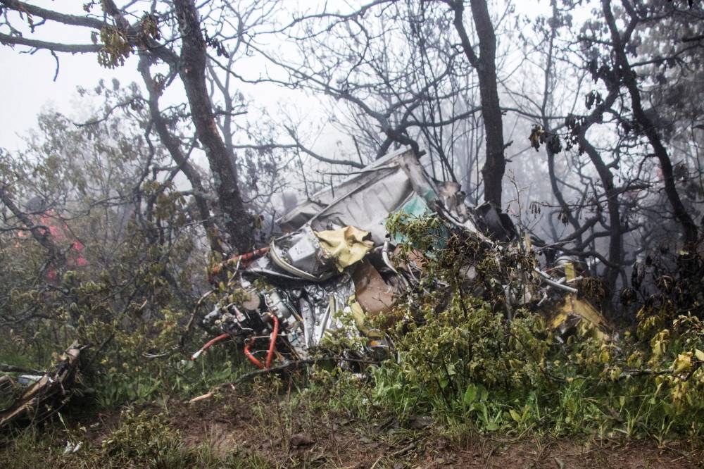 A view of the wreckage of Iranian president Ebrahim Raisi's helicopter at the crash site on a mountain in Varzaghan area, northwestern Iran, May 20, 2024. Stringer/WANA via REUTERS
