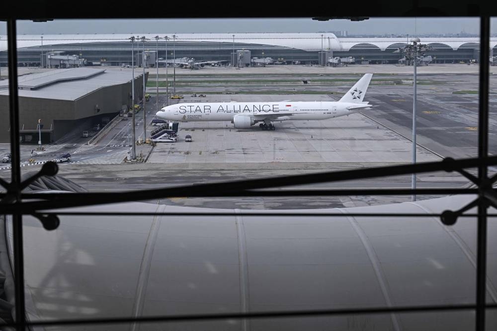 The Singapore Airlines flight SQ321, which was headed to Singapore from London before making an emergency landing in Bangkok due to severe turbulence, is seen on the tarmac at the Suvarnabhumi International Airport in Bangkok on Wednesday. AFP