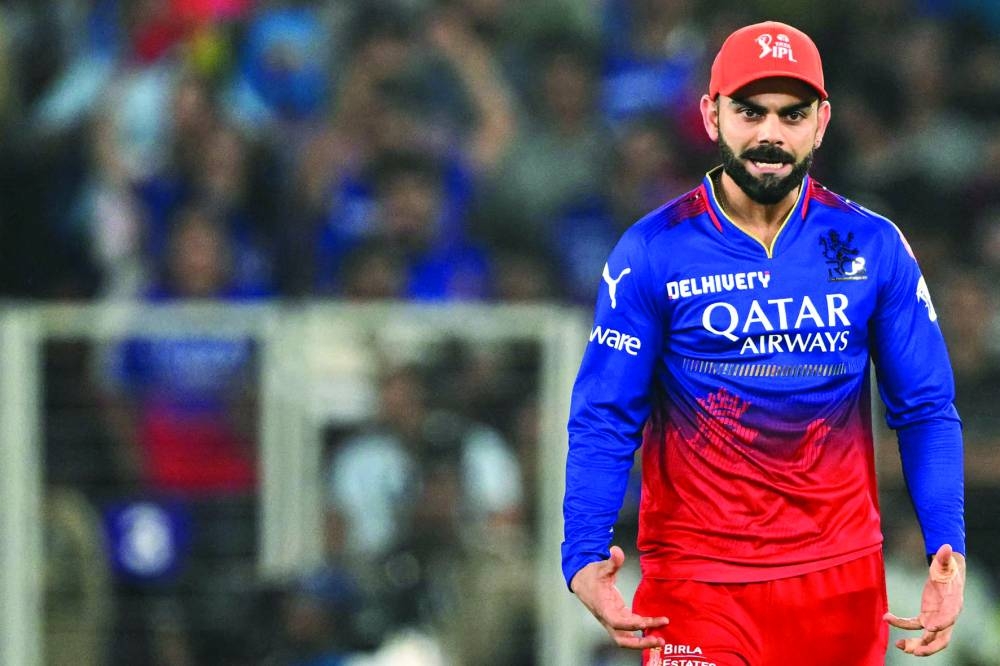 
RCB’s Virat Kohli celebrates the dismissal of RR’s captain Sanju Samson during IPL eliminator match in Ahmedabad on Wednesday. (AFP)  