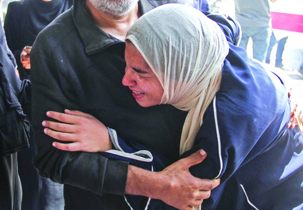 A woman reacts in the aftermath of an Israeli strike, amid the ongoing conflict between Israel and the Hamas group, in Gaza City, on Saturday.