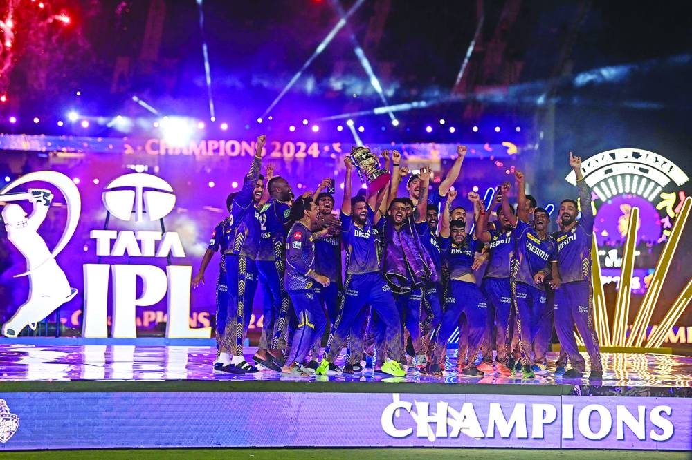 Kolkata Knight Riders’ players celebrate with the trophy after winning the Indian Premier League final against Sunrisers Hyderabad at the MA Chidambaram Stadium in Chennai on Sunday. (AFP)