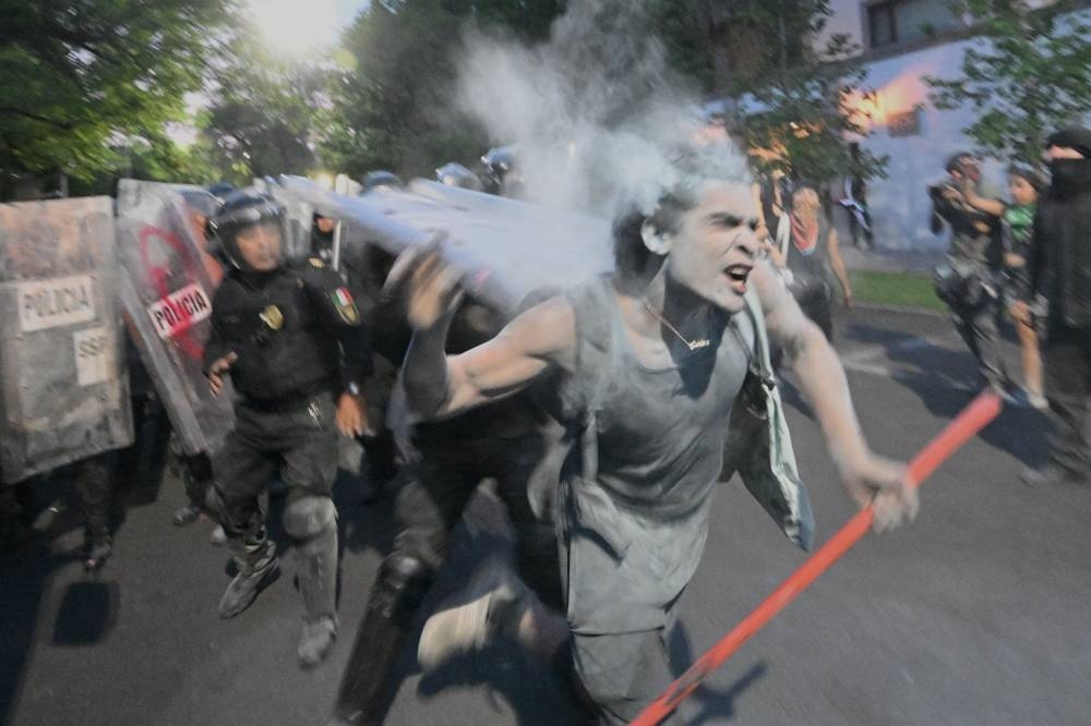 Demonstrators clash with the police during a pro-Palestinian rally called "Urgent action for Rafah", held in front of the Israeli embassy in Mexico City on Tuesday. AFP