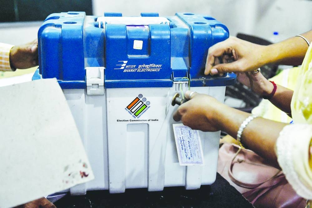 
Polling officials seal Electronic Voting Machines (EVMs) and Voter Verifiable Paper Audit Trail (VVPAT) at the end of the final phase of voting in India’s general election, at a polling station in Jalandhar. 