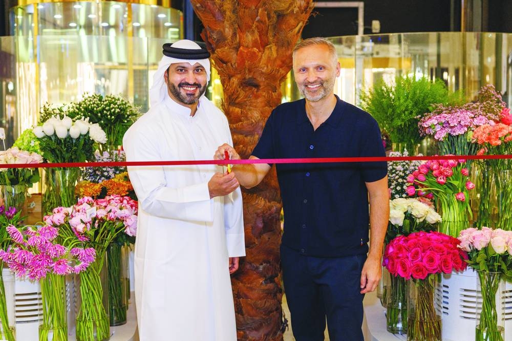 Fardan Fahad Alfardan, general manager of Wahet Al Shaflahiya, and Spale Marcinko, director of Moyses Stevens UK, leading the ribbon-cutting ceremony.
