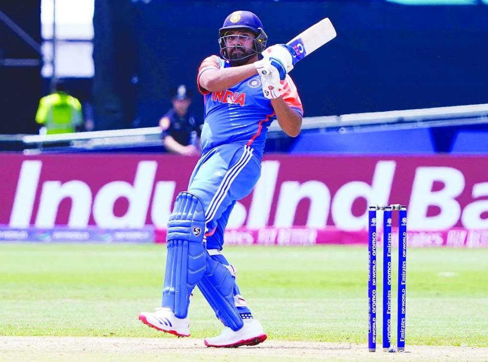 India’s captain Rohit Sharma bats during the ICC Twenty20 World Cup match against Ireland at Nassau County International Cricket Stadium in East Meadow, New York, on Wednesday. (AFP) Jasprit Bumrah of India celebrates the wicket of Harry Tector of Ireland.