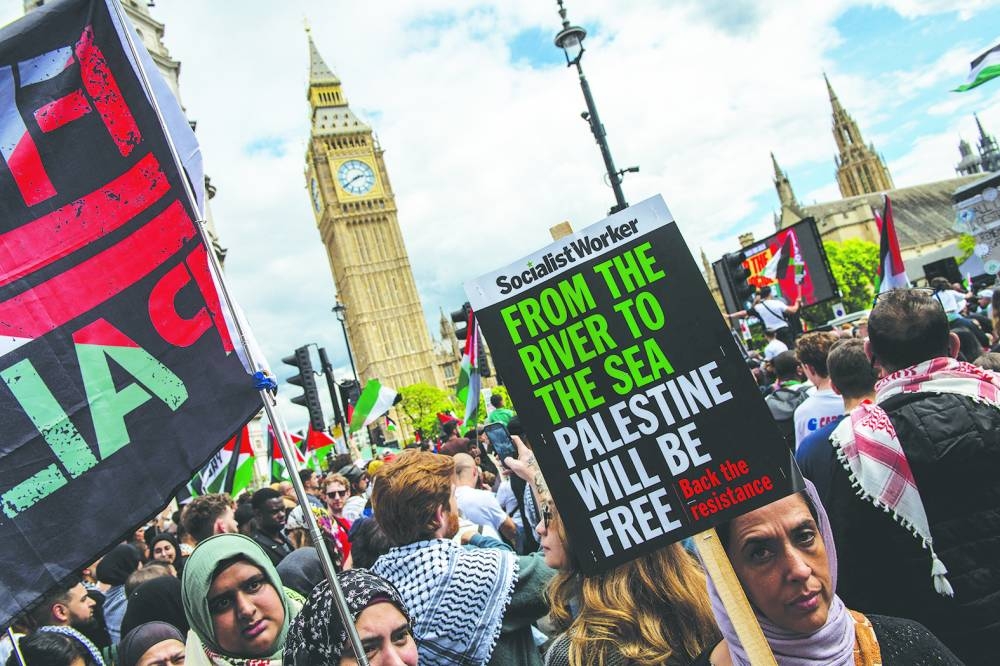 Protesters march in support of Palestinians during a demonstration in Westminster in London, on Saturday.