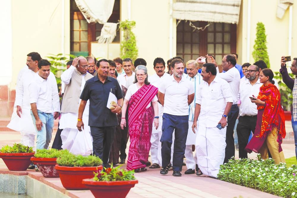 
Senior Congress leaders Rahul Gandhi and Sonia Gandhi arrive to attend a meeting of the Congress Parliamentary Party comprising all newly elected Lok Sabha Members of Parliament (MP) and Rajya Sabha MPs in Central Hall of Parliament in New Delhi. 