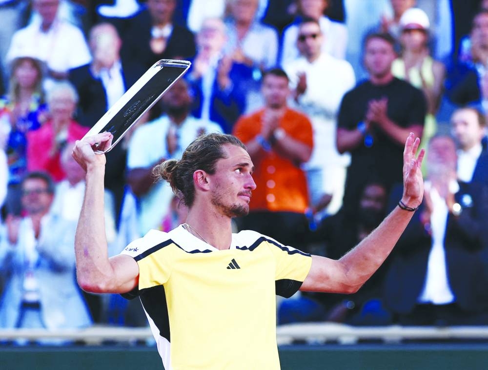 Germany’s Alexander Zverev with the runner-up trophy after losing the French Open final against Spain’s Carlos Alcaraz on Sunday. (Reuters)