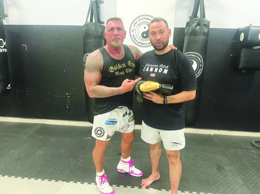 Shannon ‘The Cannon’ Ritch (left) with Doha Sports and Arts Academy’s general manager Master Rami al-Banna.
