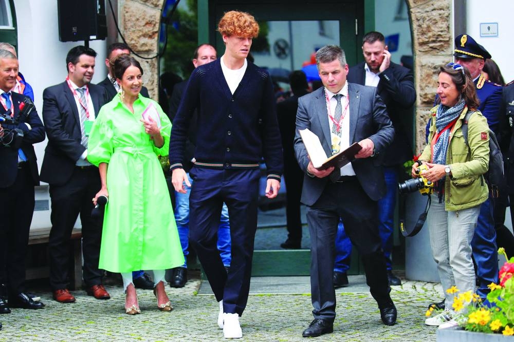 Italy’s Jannik Sinner (centre) attends a welcome ceremony in his home town with Sexten mayor Thomas Summerer in Sesto (Sexten) in the Dolomites, Italy, on Tuesday. Sinner is the new and first ever Italian to be number one tennis player in the ATP rankings. (AFP)