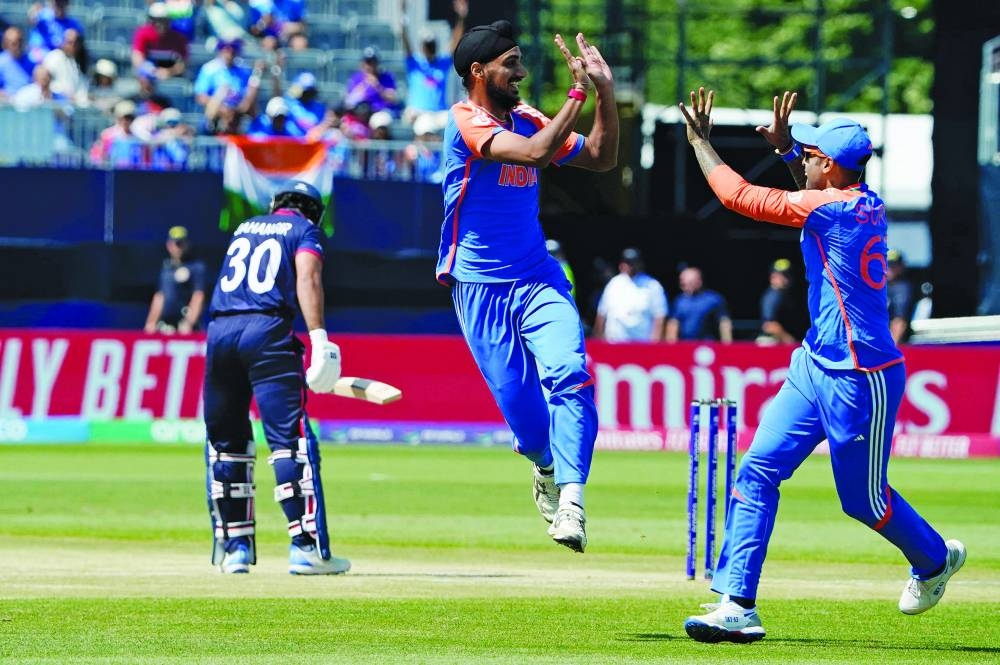 India’s Arshdeep Singh celebrates a successful lbw with a teammate during the ICC Twenty20 World Cup match against the USA at Nassau County International Cricket Stadium in East Meadow, New York, on Wednesday. (AFP)